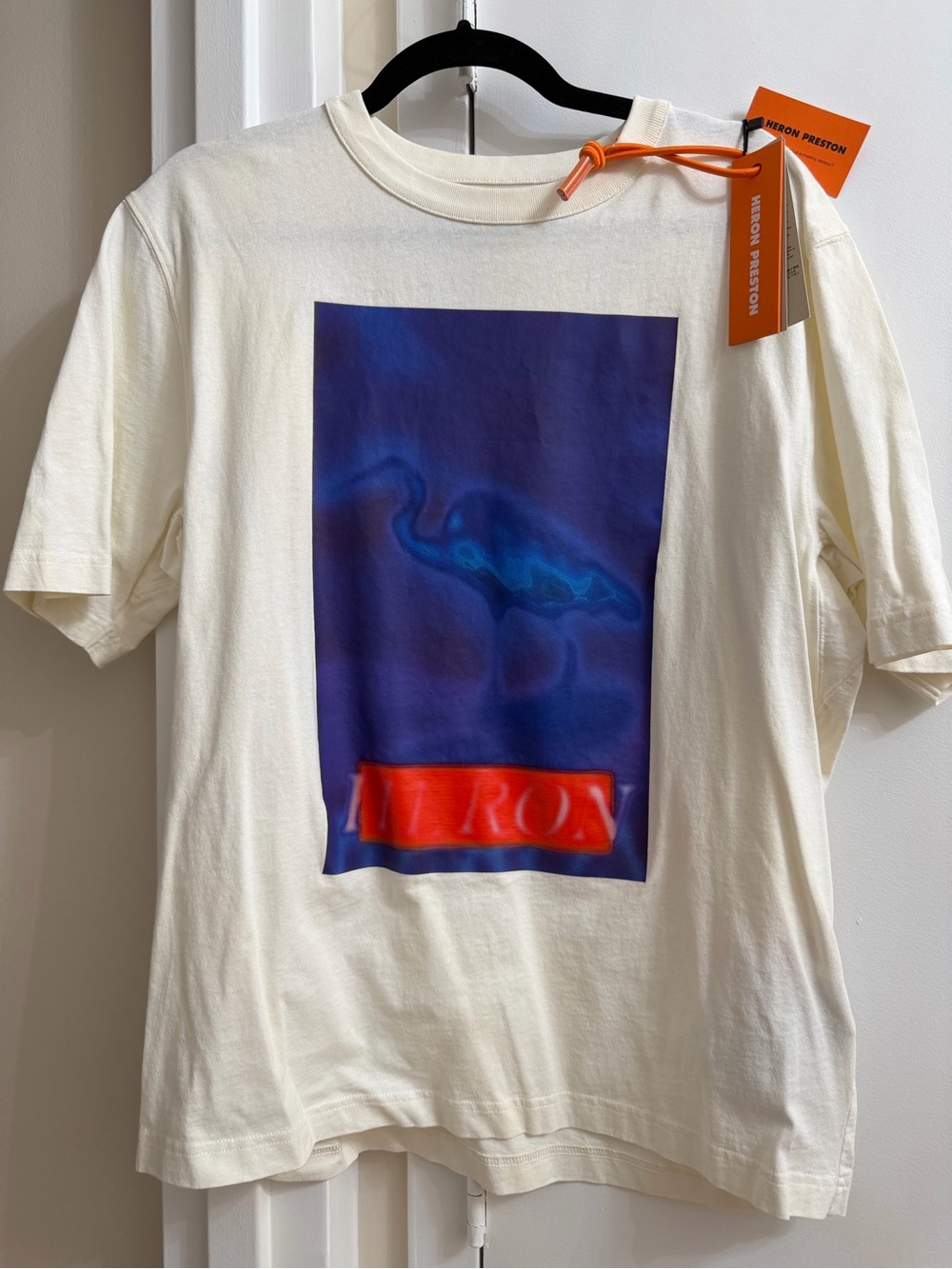 Heron Preston Cream Short Sleeve Tee with Blue Graphic and Orange Accent